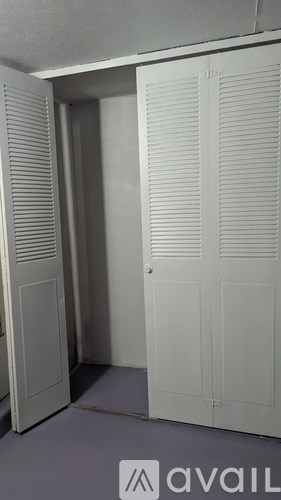 A white door with a sign that says "available" in front of it.