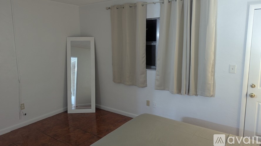 A room with a large mirror and a table.