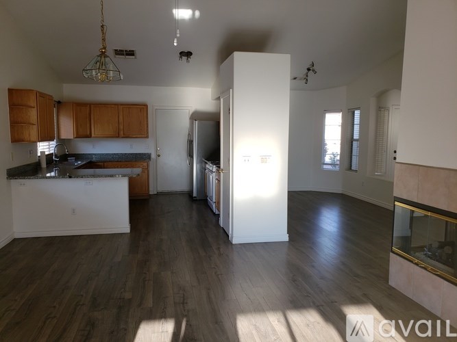 A kitchen with wooden cabinets and a white countertop.