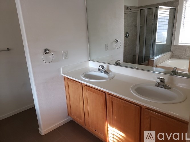 A bathroom with a sink and mirror.