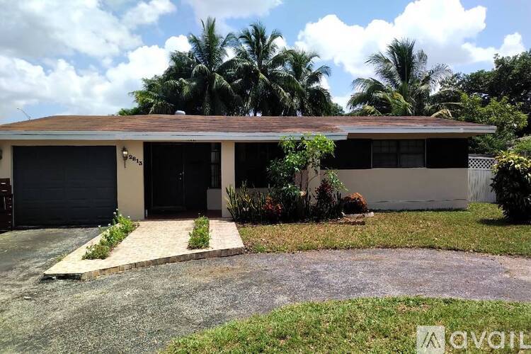 A house with a driveway and a garage door.