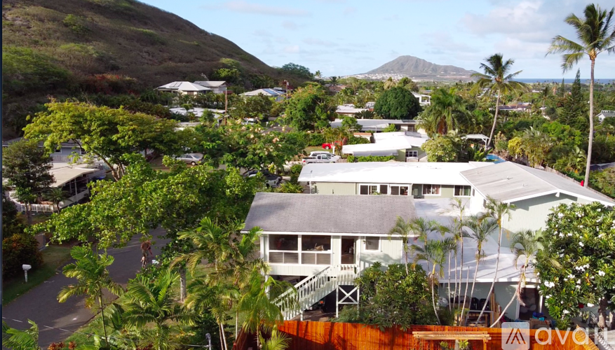 A view of a resort with a mountain in the background.
