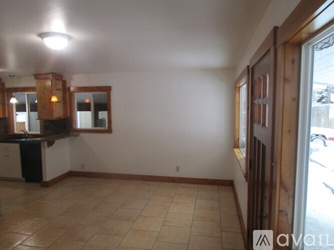 A kitchen area with a counter and cabinets.