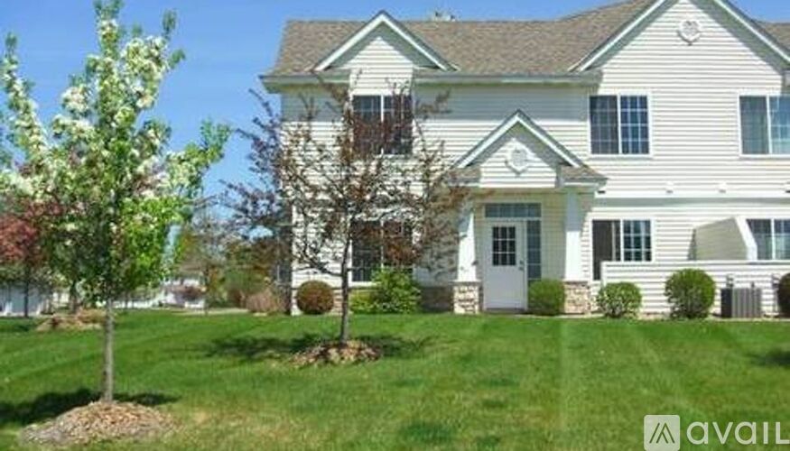 A house with a tree in front of it.