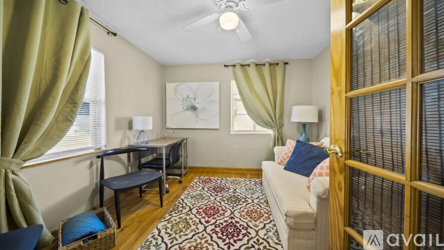A living room with a couch, chair, and table.