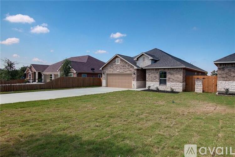 A large house with a garage is available for sale.