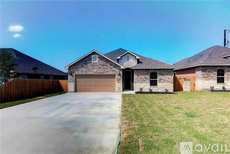 A house with a garage is for sale.