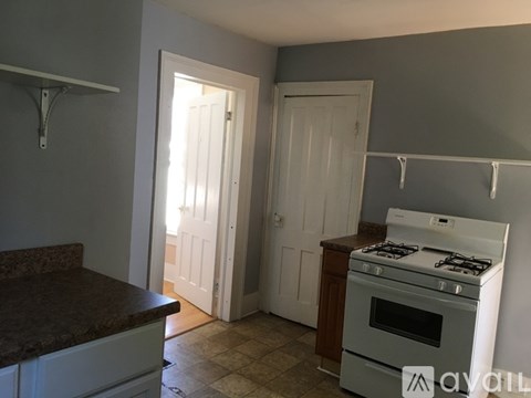 A kitchen with a stove and a counter.