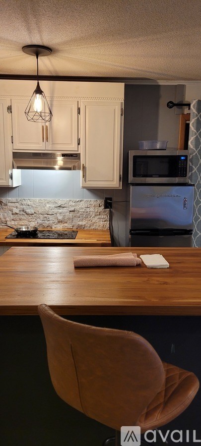 A potted plant sits on a wooden deck.