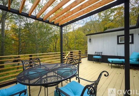 A patio with a table and chairs is available for rent.