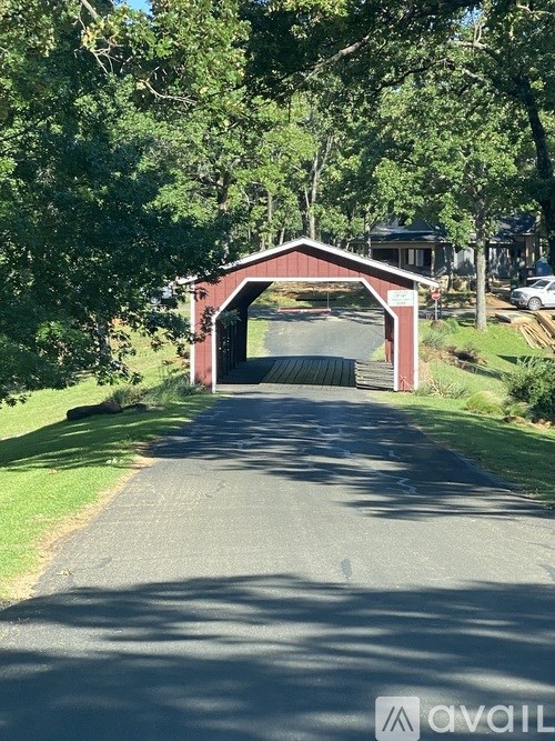A road leading to a covered bridge.
