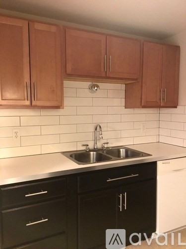 A kitchen with a sink and cabinets.