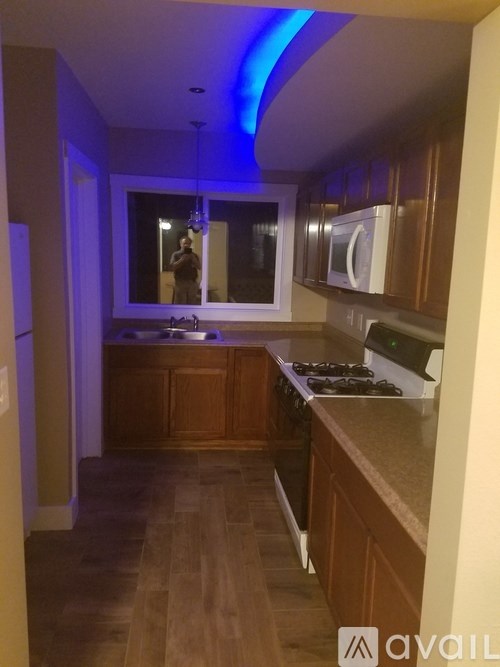 A kitchen with wooden cabinets and a countertop.