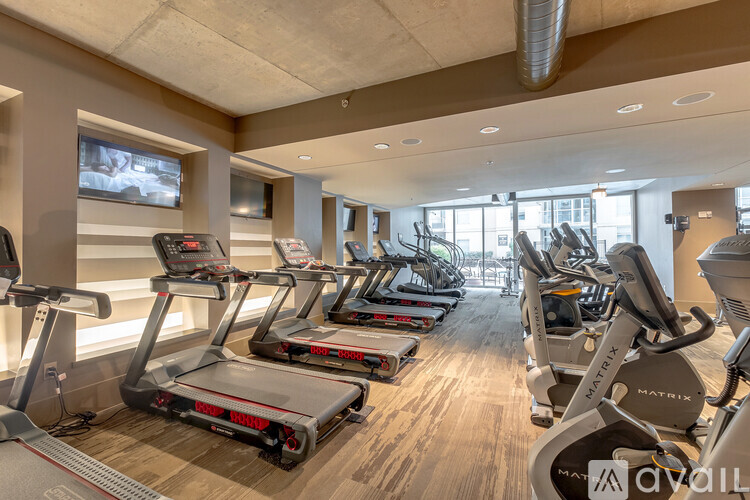 A gym with treadmills and exercise equipment.