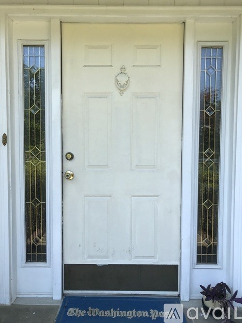 A white door with a glass window on the left and a glass window on the right.
