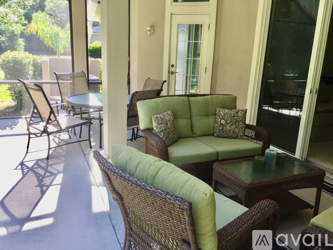 A patio with a table and chairs.