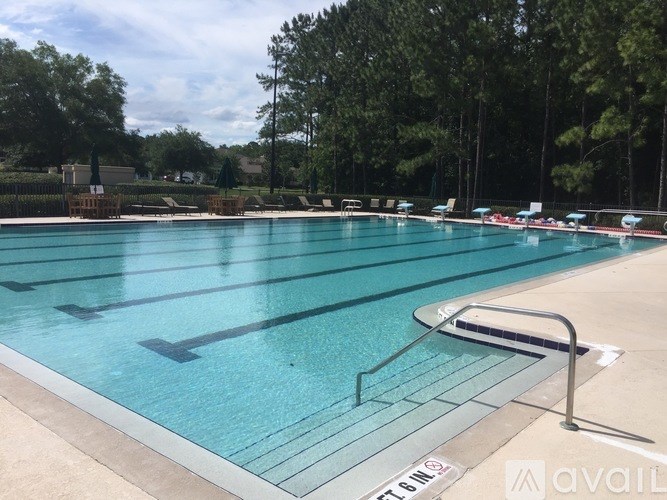 A large swimming pool with lanes marked on the water.
