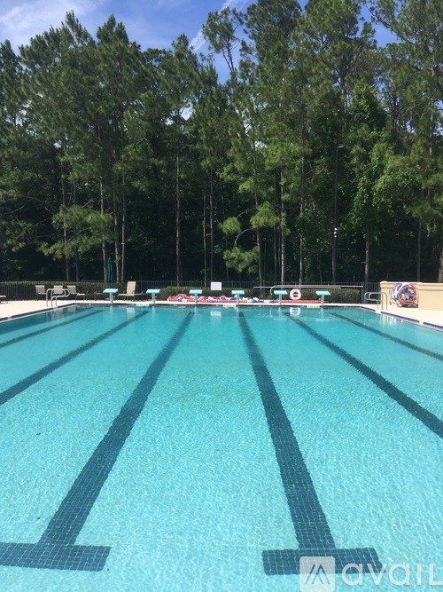 A swimming pool with lane markers and a no diving sign.
