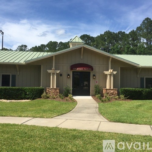 The front of a building with a green roof and a sign that reads "Covidine Polls.".
