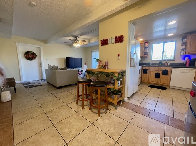 A kitchen with a bar area in the middle of the room.