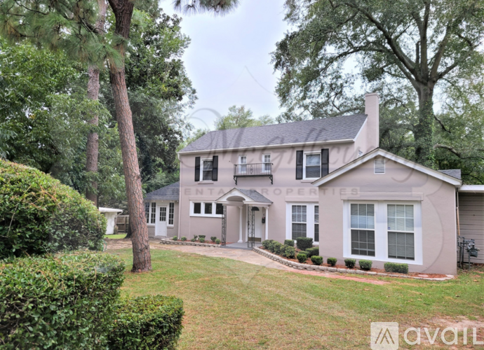 A house with a sign that says "Ole Gilfillan Renting Place" in front of it.
