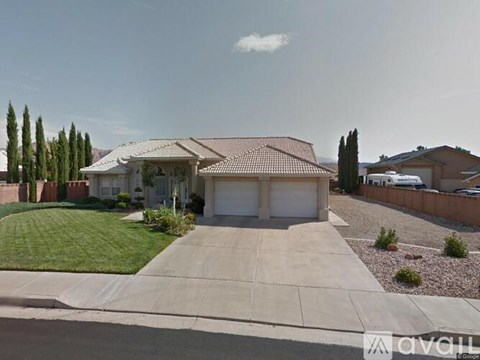 A house with a driveway and a garage is shown in the image.
