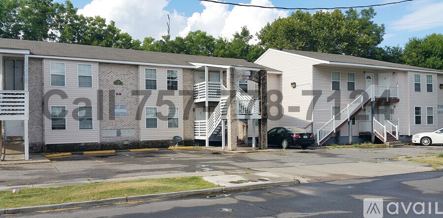 Apartment complex with the numbers 75 and 87 on the side of the buildings.