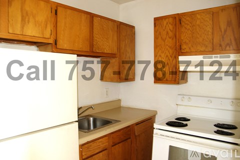 A kitchen with wooden cabinets and a stove top oven.