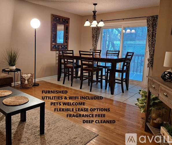 A dining room with a table and chairs is available for rent.