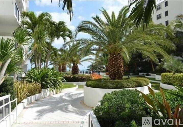 A tropical garden with a pineapple in the center.