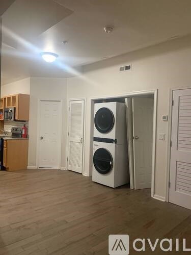 A room with a washing machine and dryer in it.