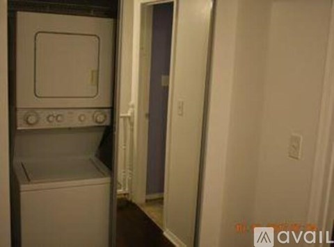 A small kitchen with a white oven and a white dishwasher.