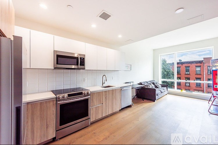 A kitchen with wooden cabinets and stainless steel appliances.