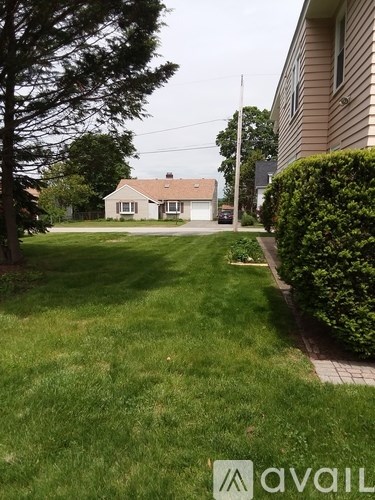 A house with a lawn in front of it.