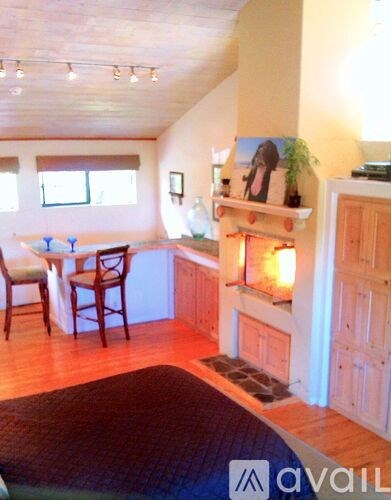 A room with a table and chairs in it.