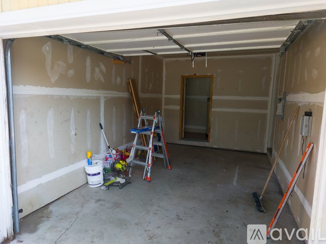 A room with a window and wooden flooring is available for rent.