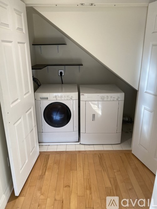 A laundry room with a washer and dryer.