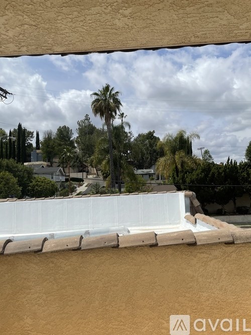 A white wall with Avail logo on it.