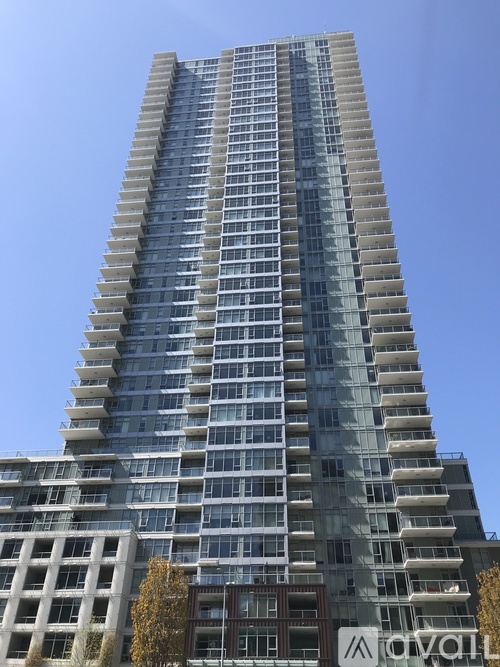 A tall building with a sign that reads "AROVA".