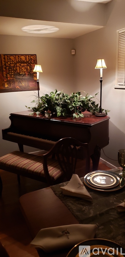 A table with a plate and napkin on it.