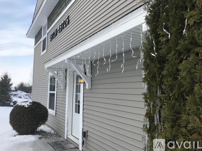 A house with a sign that says "Stonebridge" on the front.