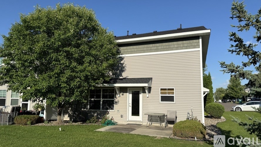 A house with a tree in front of it.