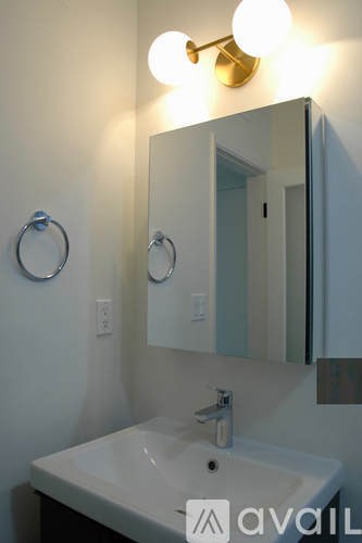 A bathroom sink with a mirror above it.