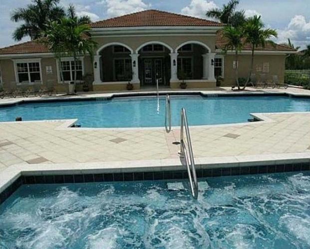 A pool with a ladder in the middle of it.