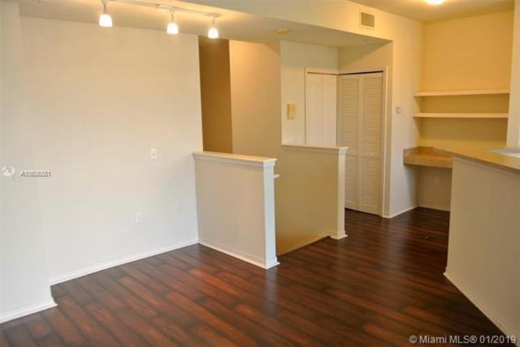 A room with wooden floors and white walls.
