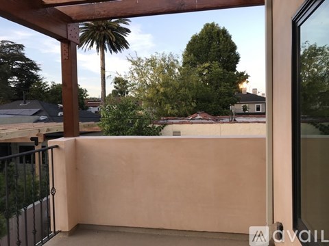 A balcony with a view of a residential area.