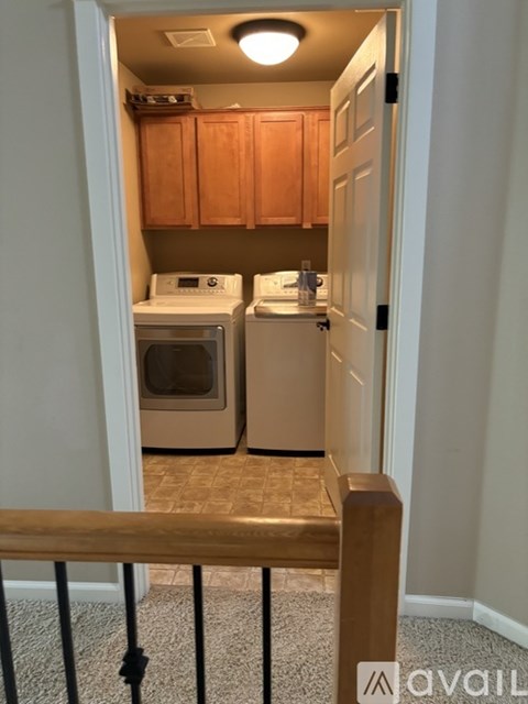 A small kitchen with a white stove and a white oven.