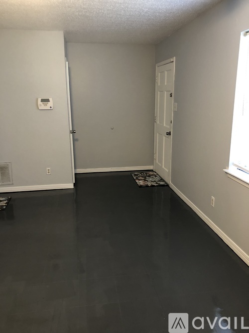 A room with a door and a window.
