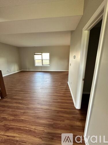 A kitchen with a table and chairs in the middle of the room.