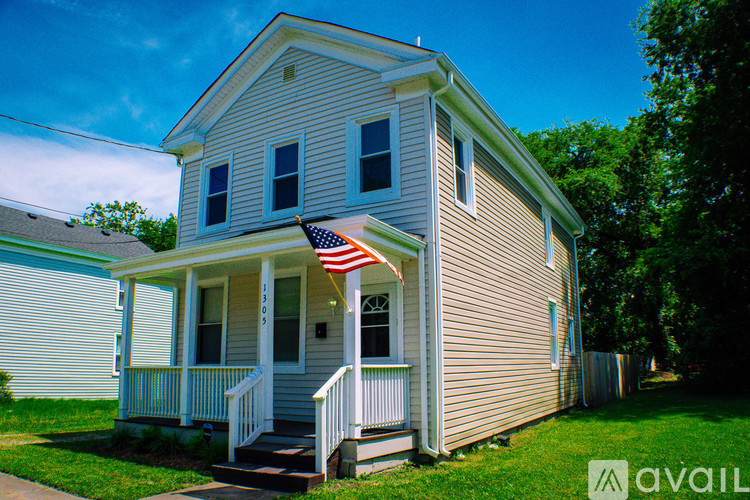 A house with a flag on the porch.